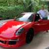 Keith A Gray with his red Porsche 911 GTS
